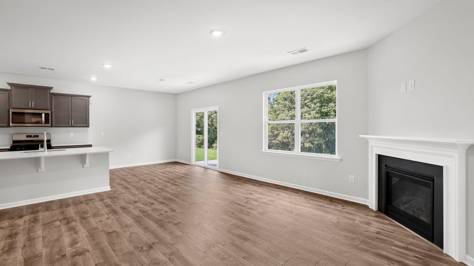 Family room with windows and fireplace.