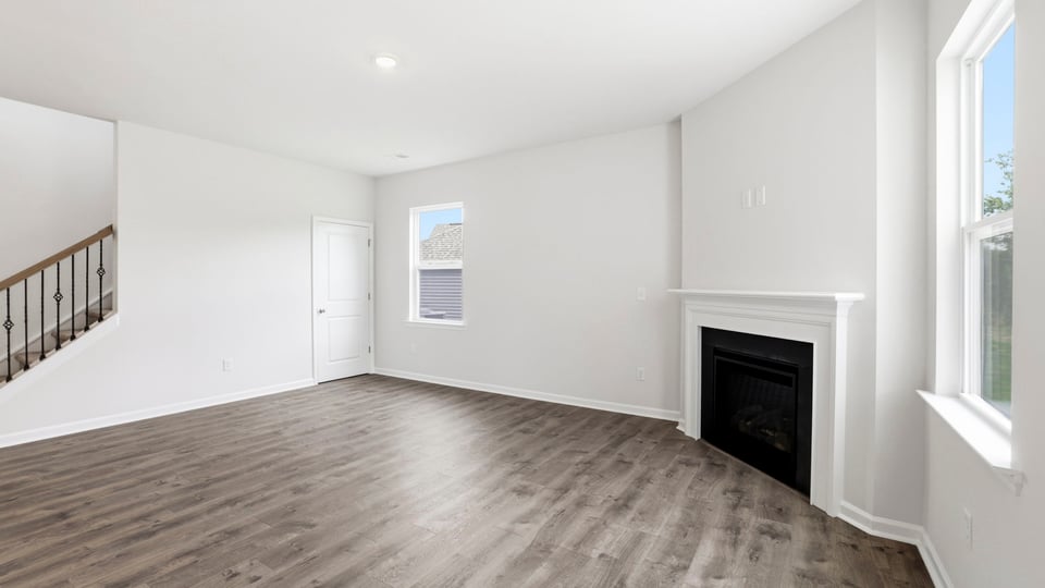 Family room with windows and fireplace.