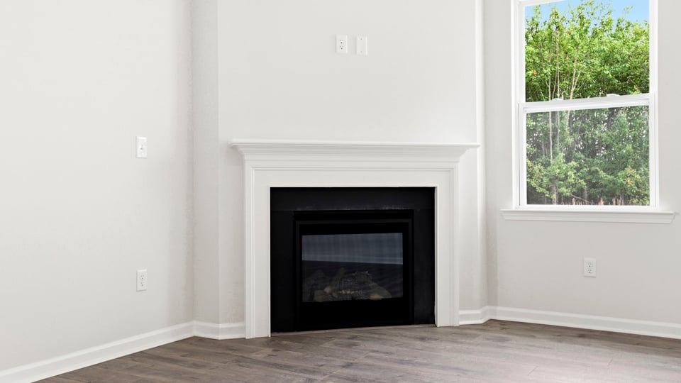 Family room with windows and fireplace.