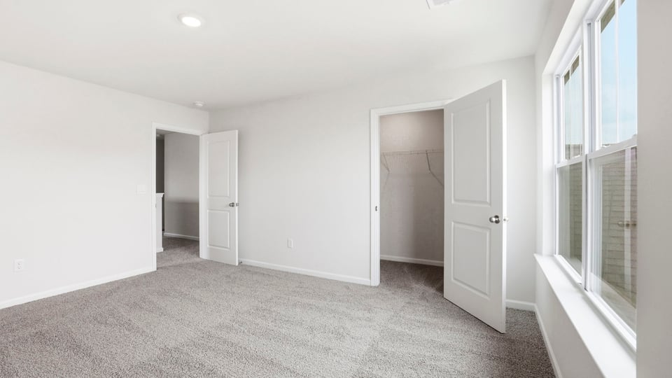 Bedroom with windows.