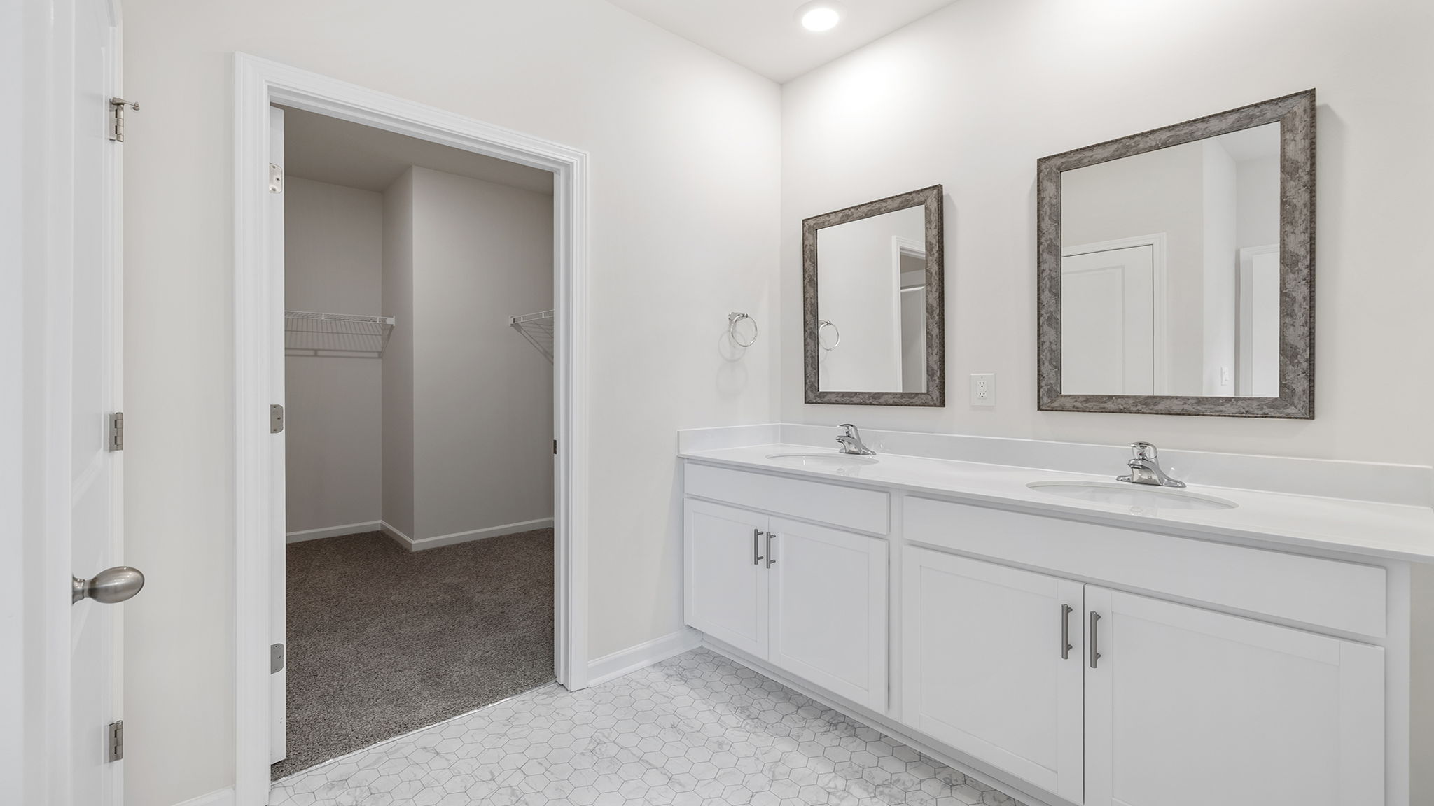 Primary bathroom with dual sink vanity.