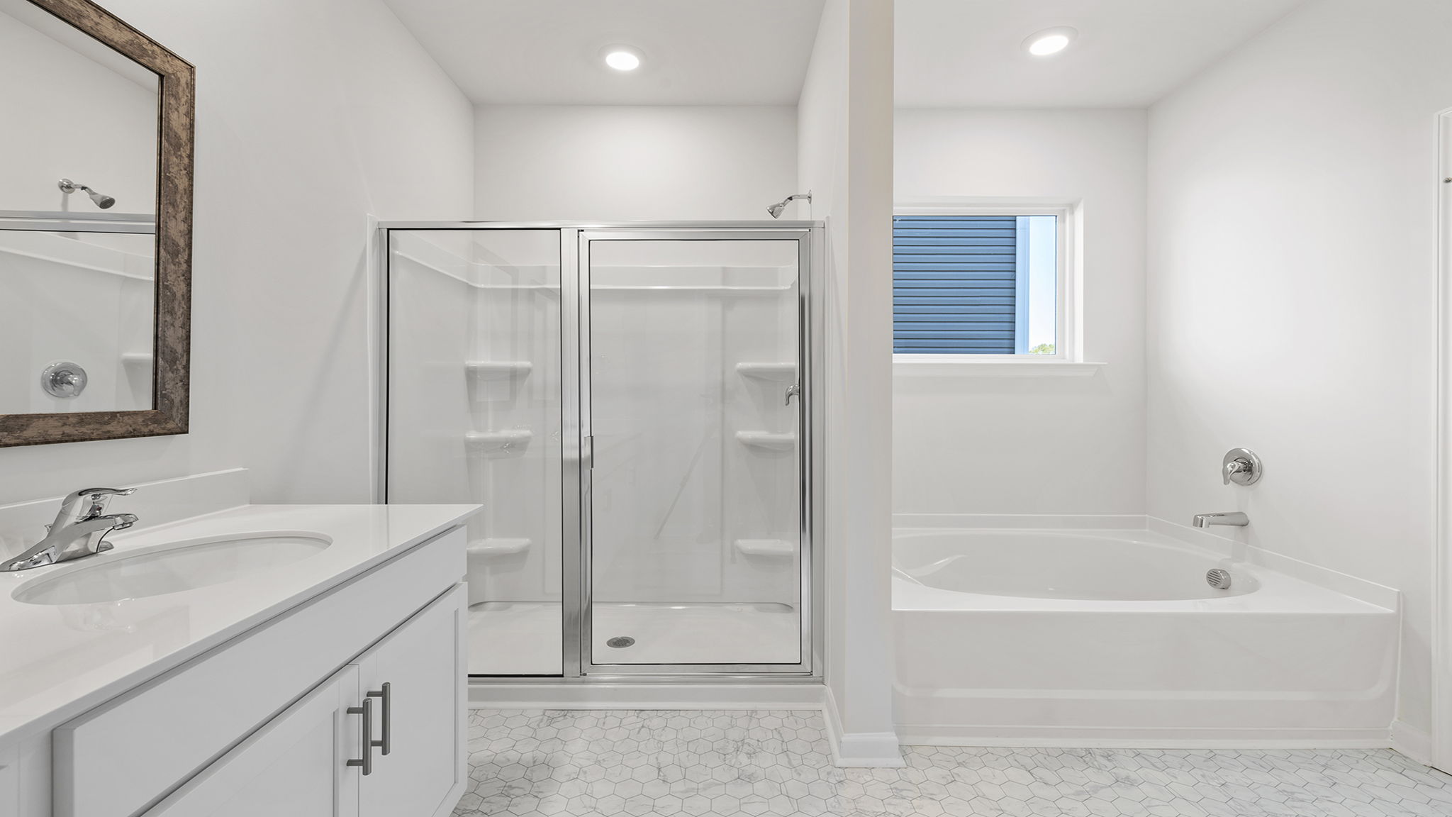 Primary bathroom with garden tub and walk-in shower.