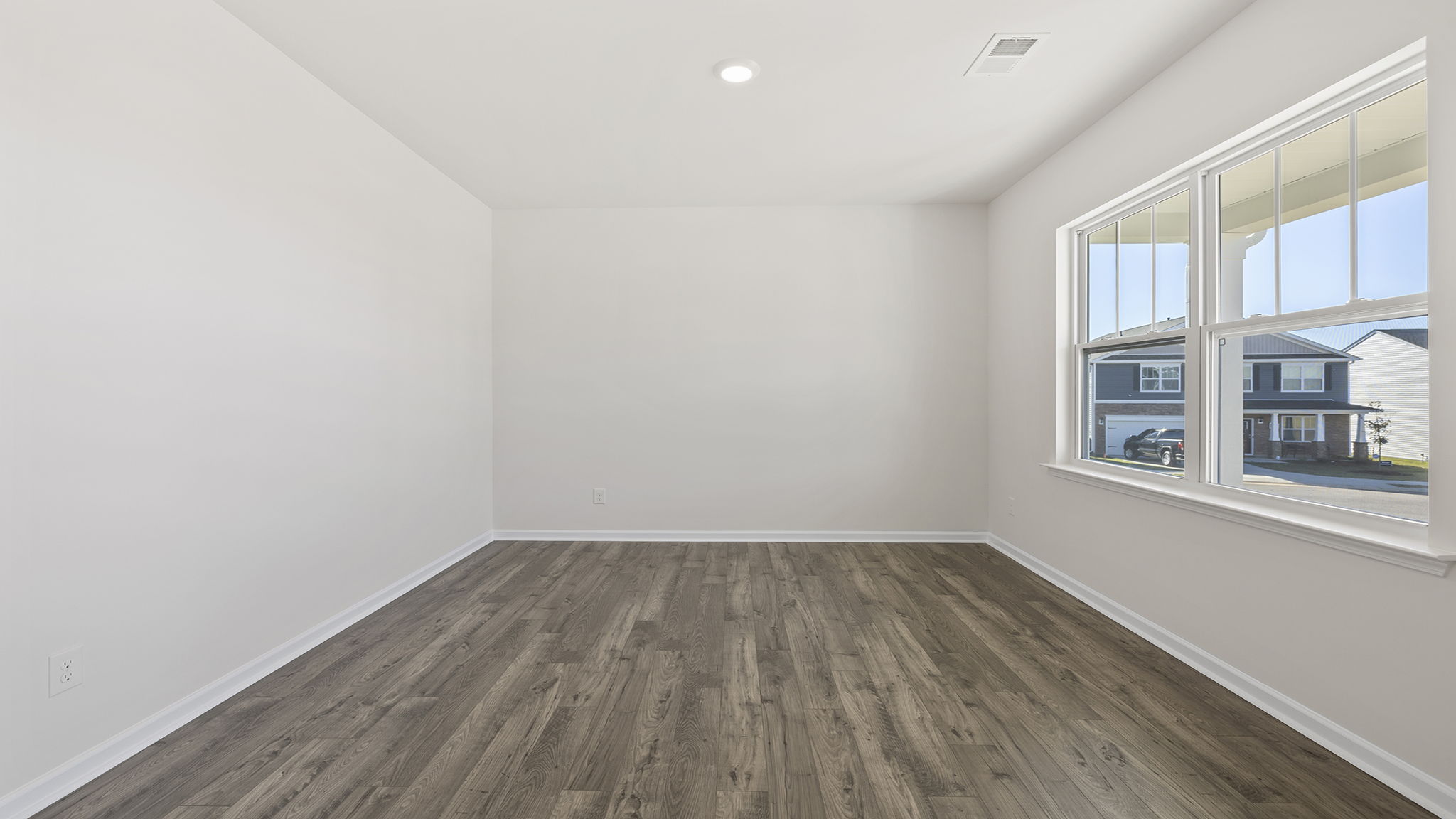 Formal dining room at front of home.