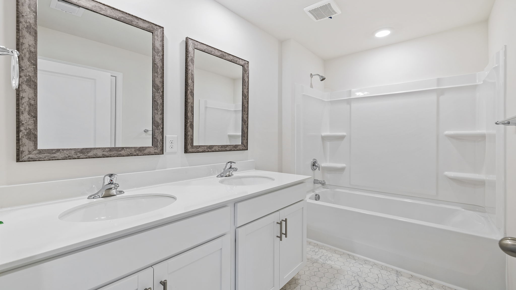 Bathroom with double vanity sinks.