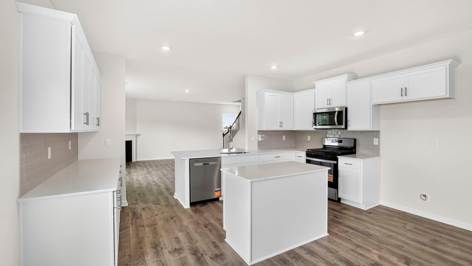 Kitchen with island and cabinets.