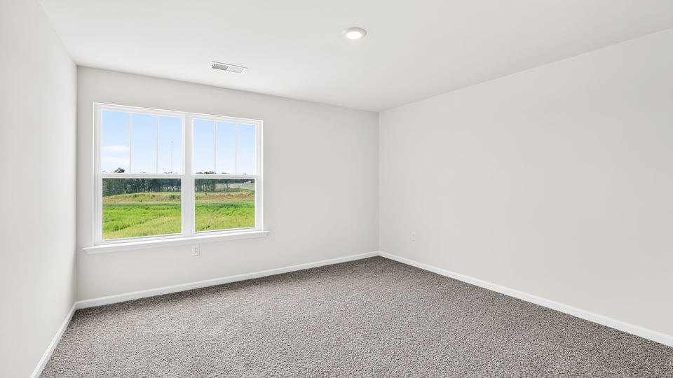 Bedroom with window and closet.
