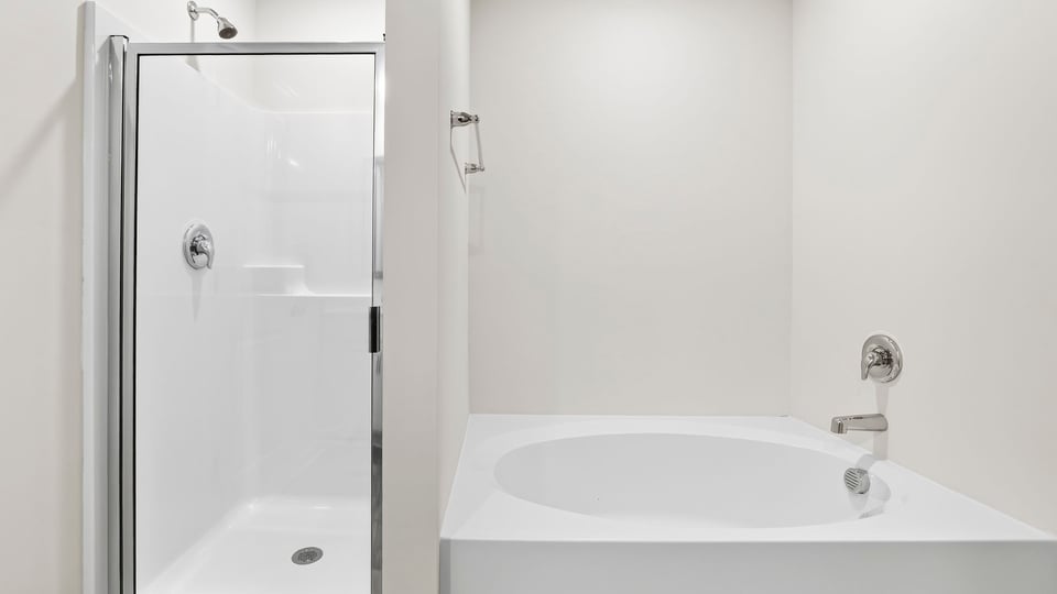 Primary bathroom with double vanity sinks.