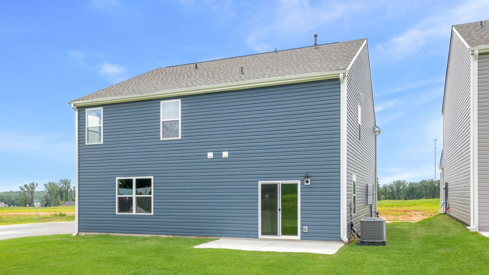 Back exterior with large backyard.
