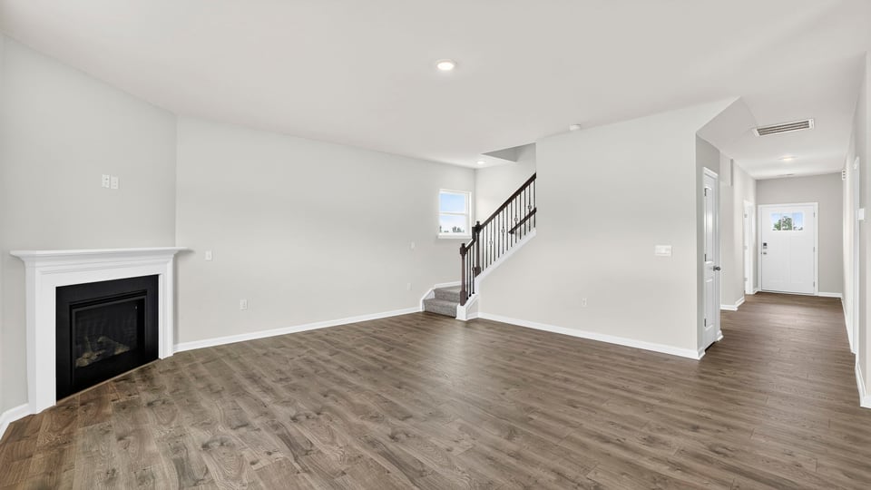 View of family room and view of the hallway to the entrance.