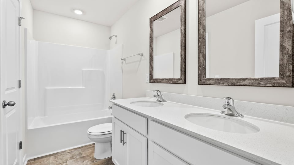 Hall bathroom with combination shower / sink.