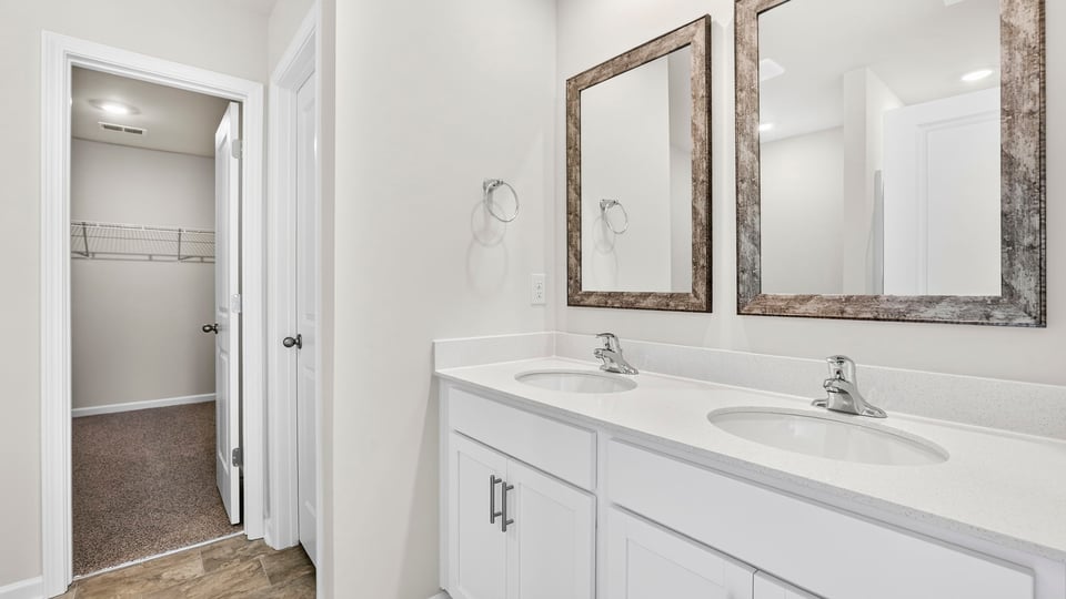 Primary bathroom dual sink vanity.