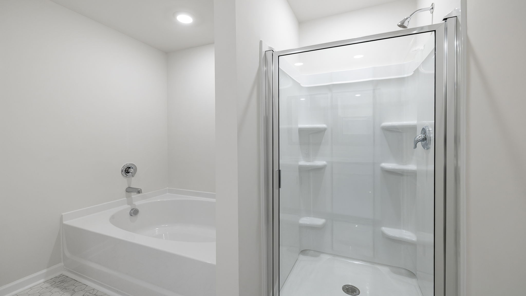 Primary bathroom with garden tub and walk-in shower.