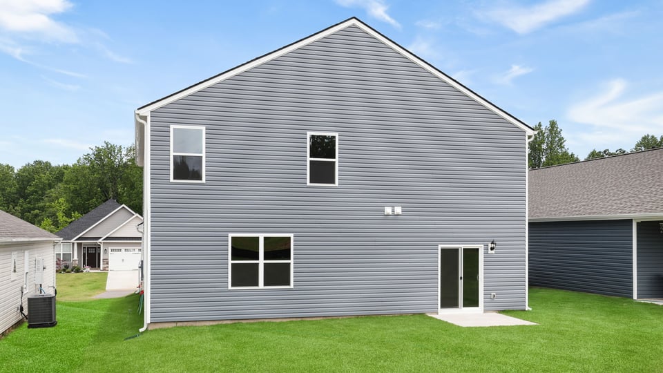 Back exterior with large backyard.