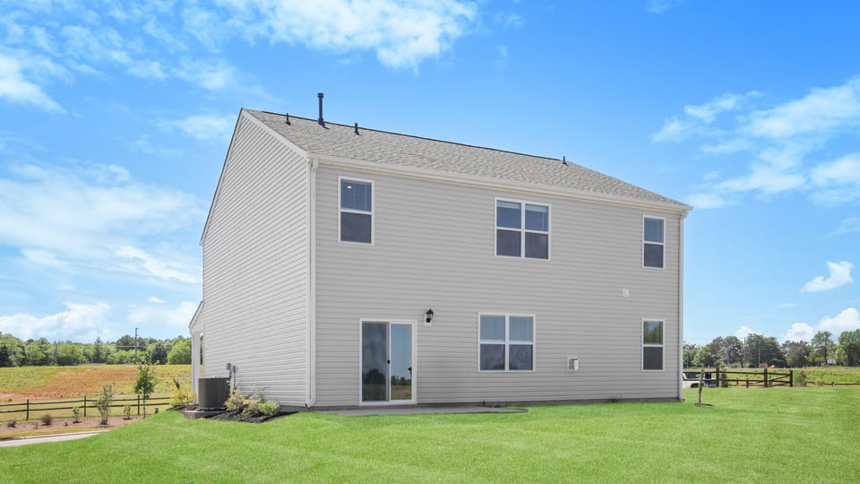 Back exterior with large backyard.