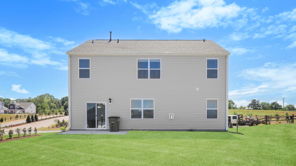 Back exterior with large backyard.