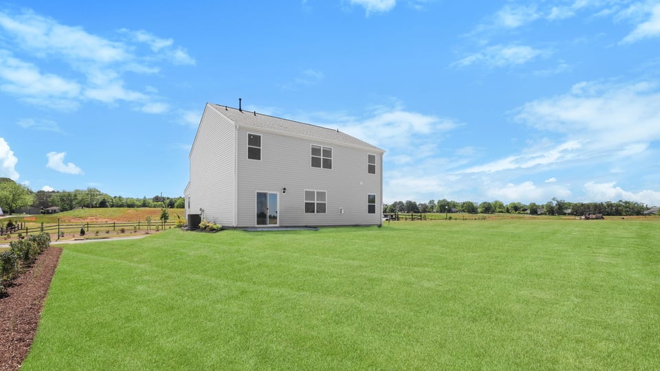 Back exterior with large backyard.