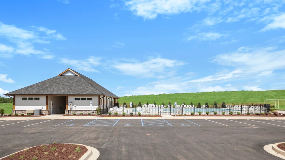 Amenity center with parking lot.