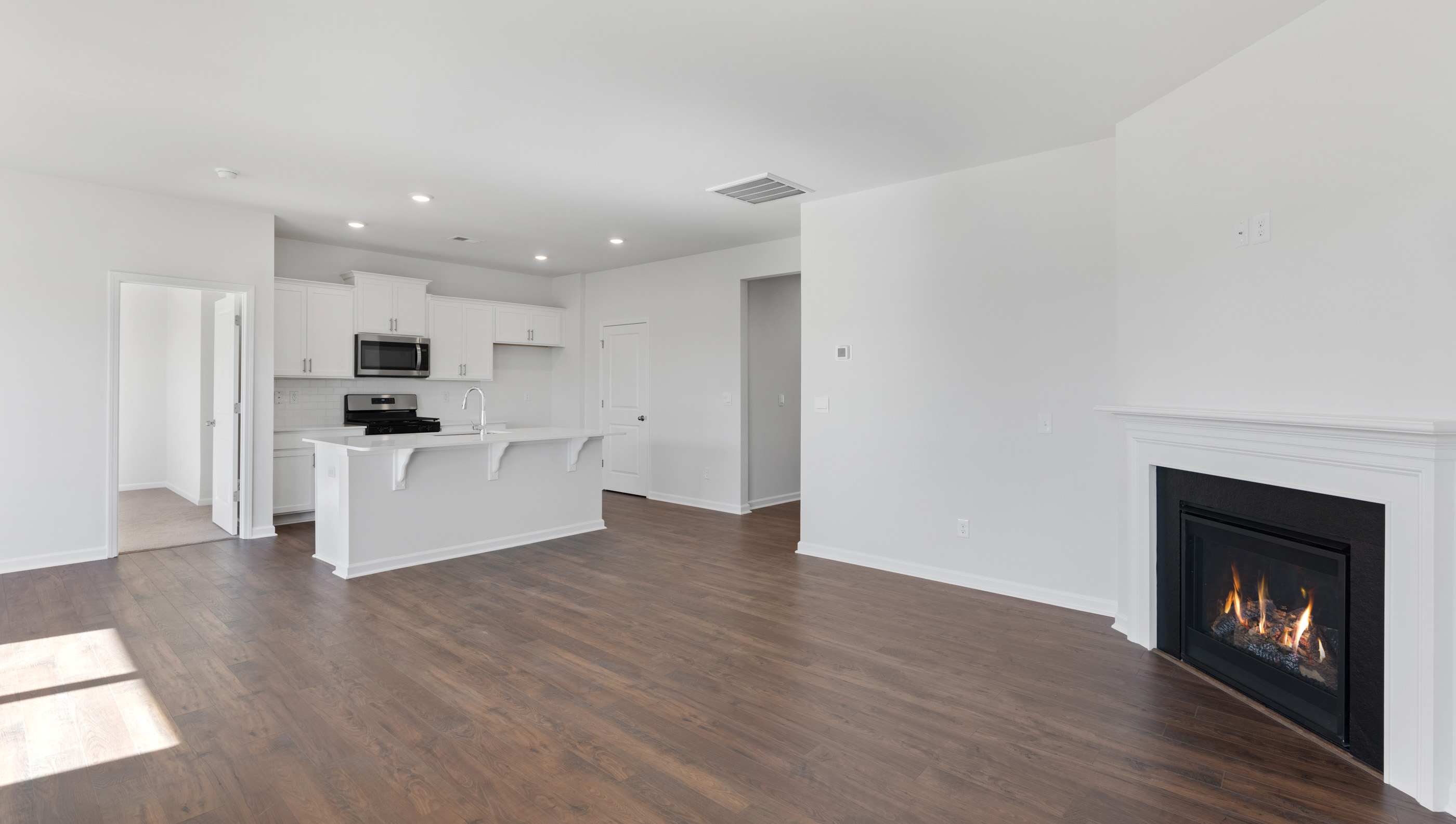 Family room with windows and fireplace.