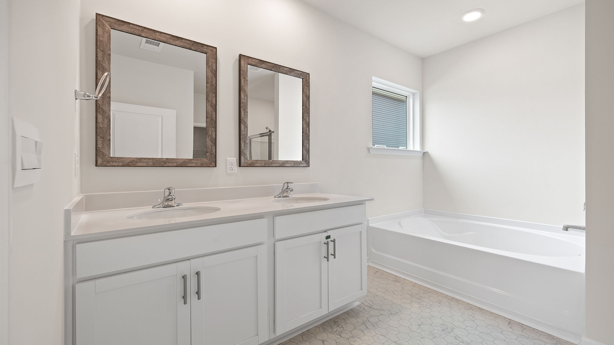 Primary bathroom with dual sink vanity.