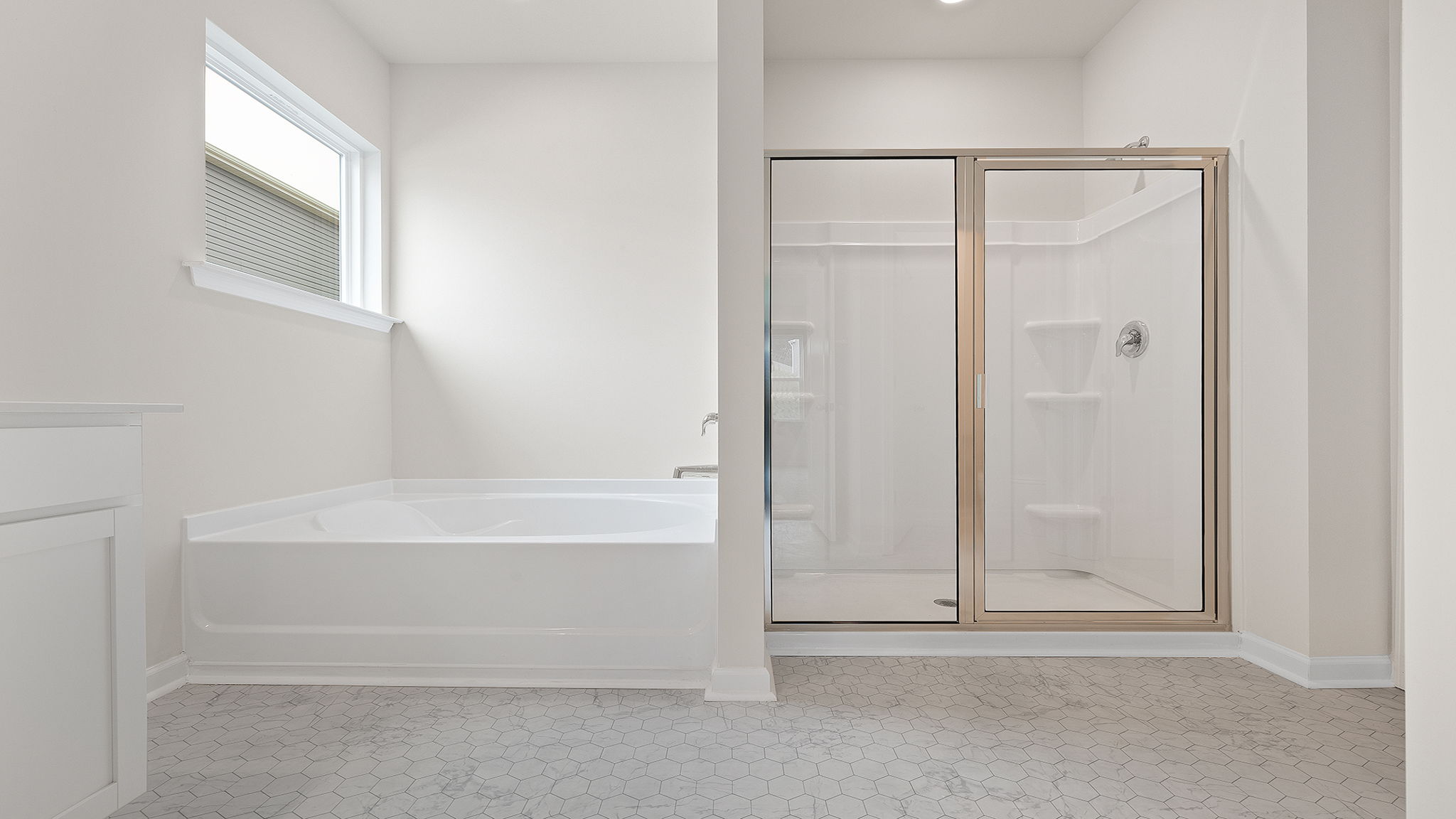 Primary bathroom with garden tub and walk-in shower.
