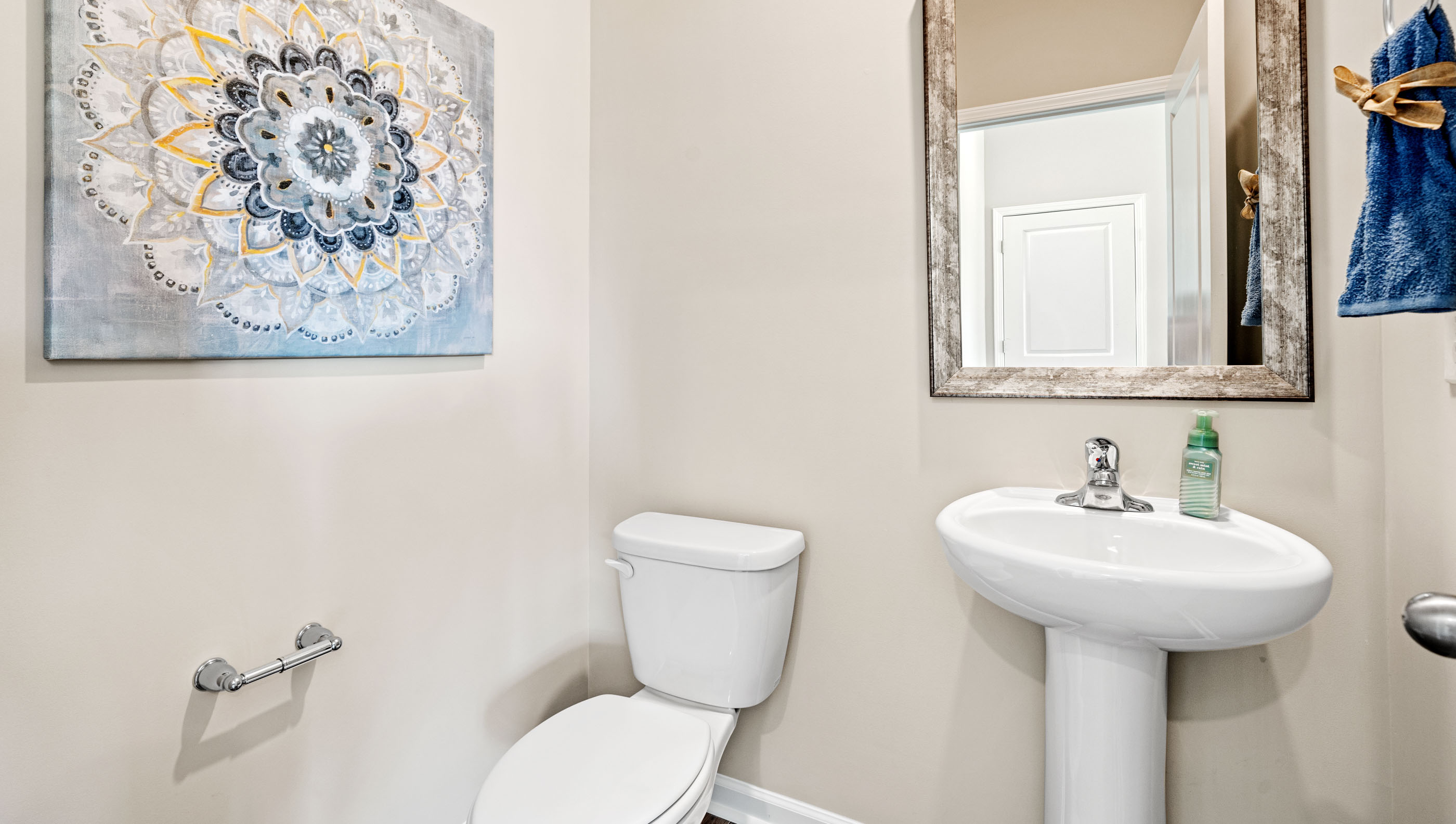 Half bathroom with mirror.