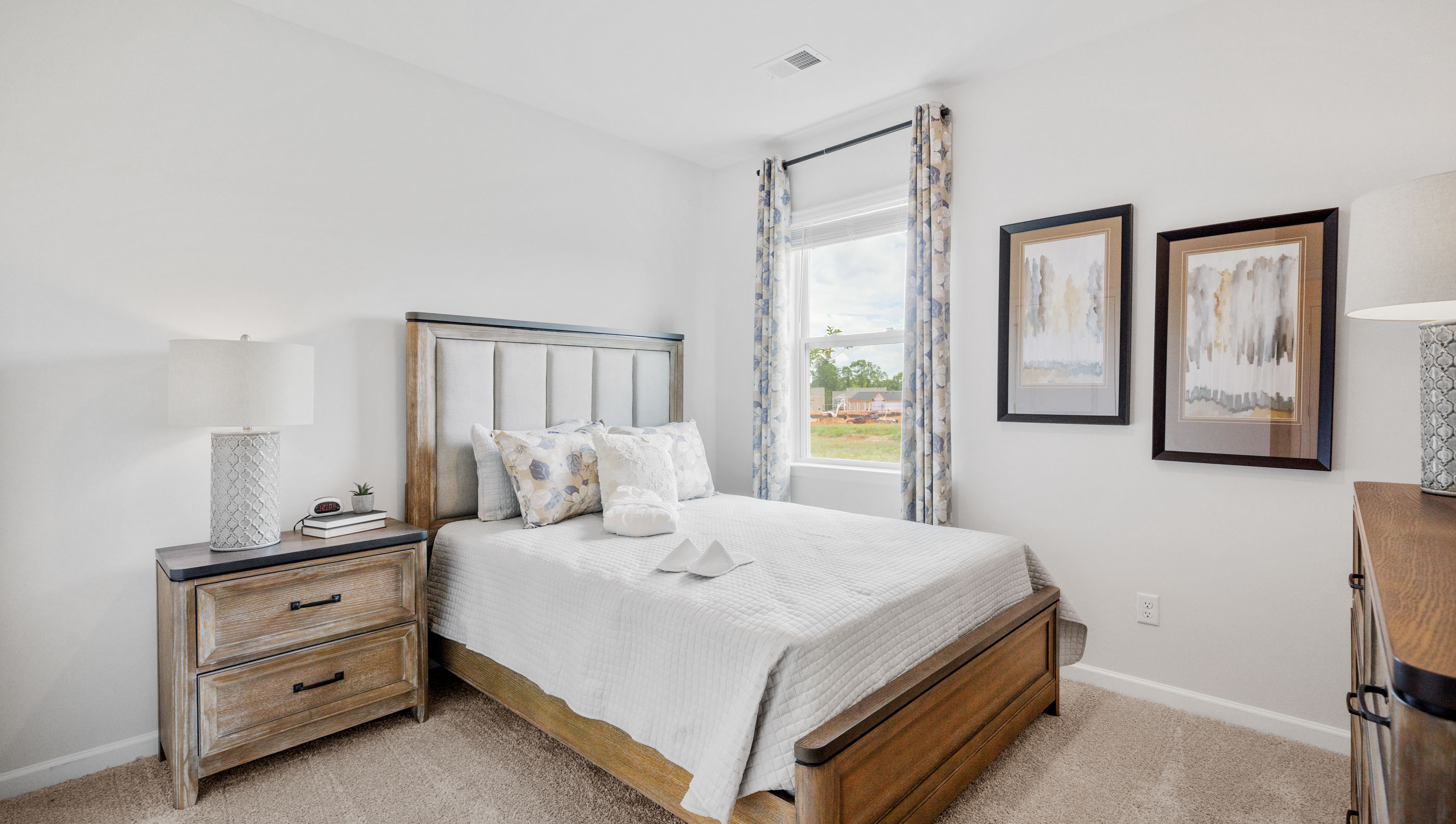 Bedroom with carpet and window.