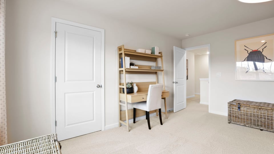 Bedroom with carpet and window.