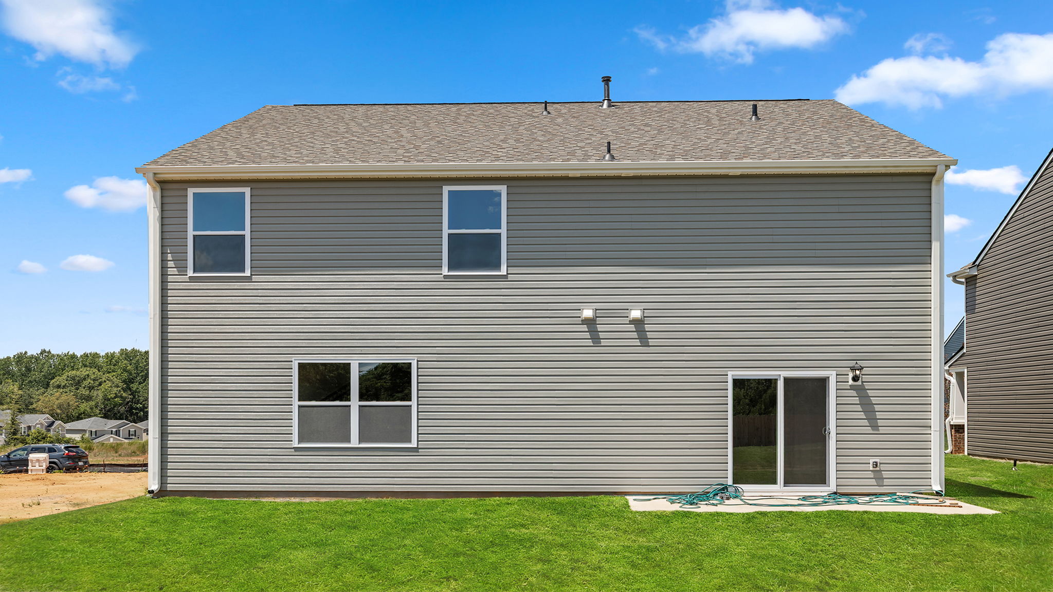 Back exterior with large backyard.