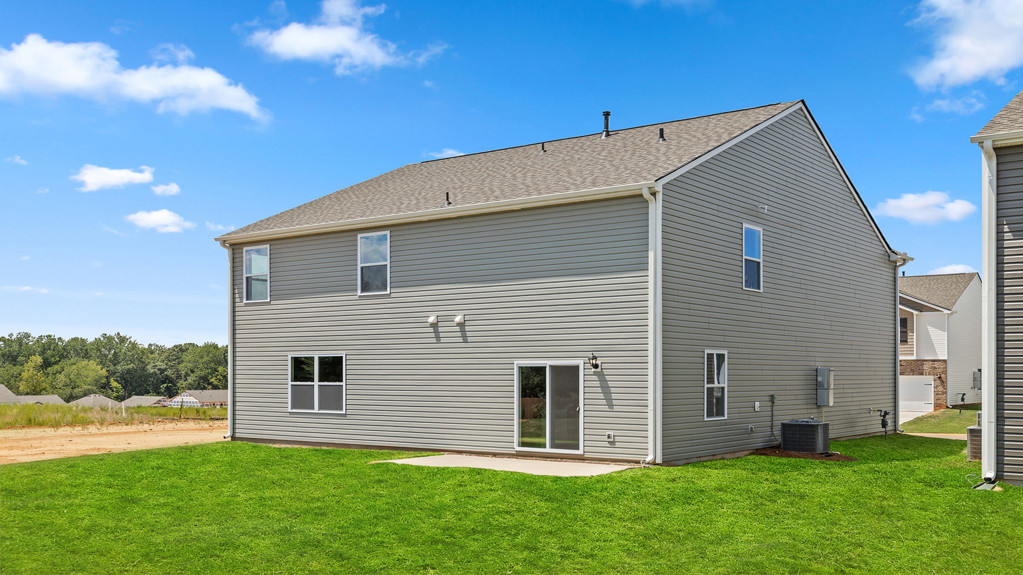 Back exterior with large backyard.