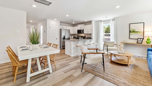 View of kitchen, dining room, and living room.