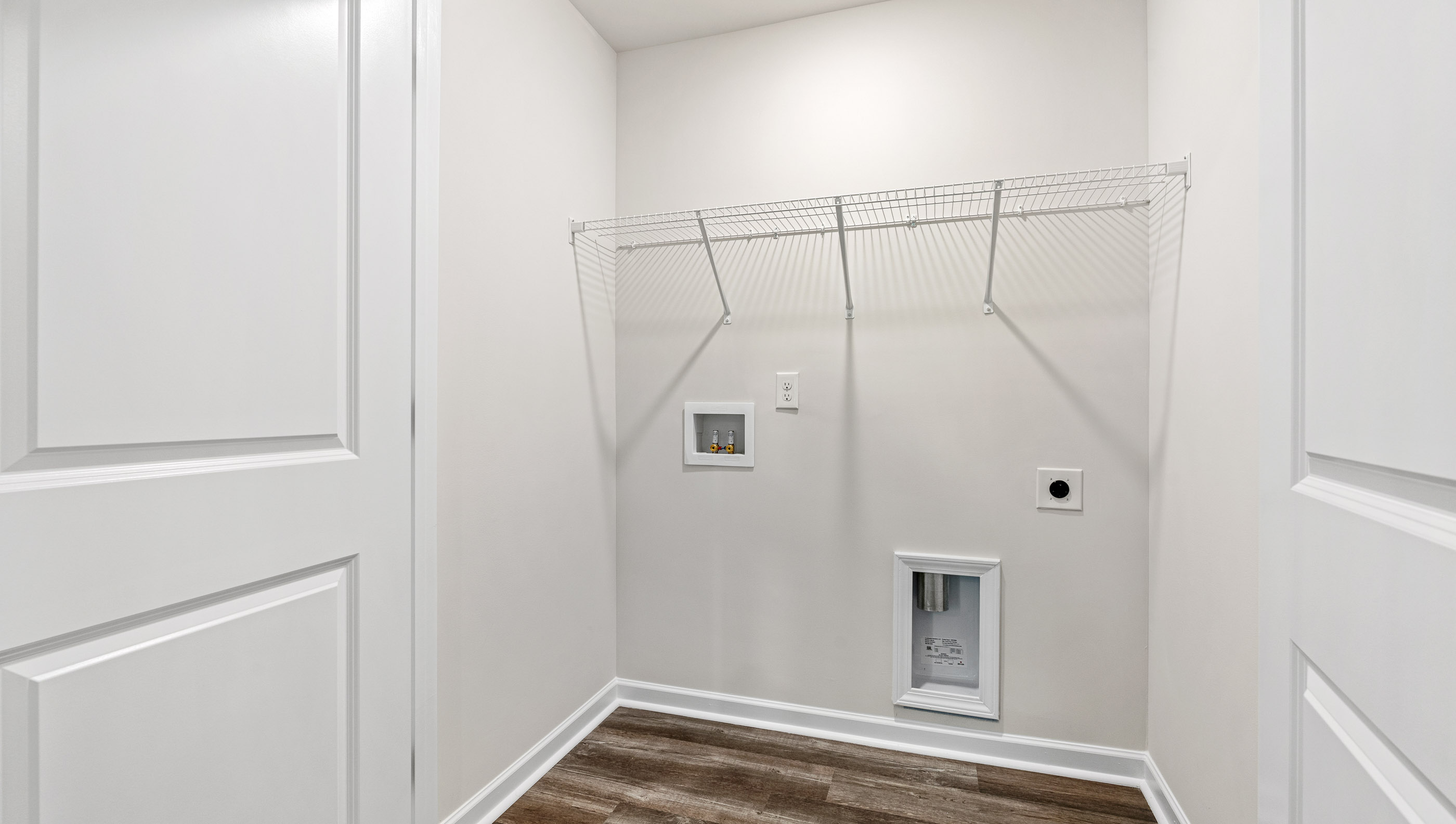 Laundry room with shelving.