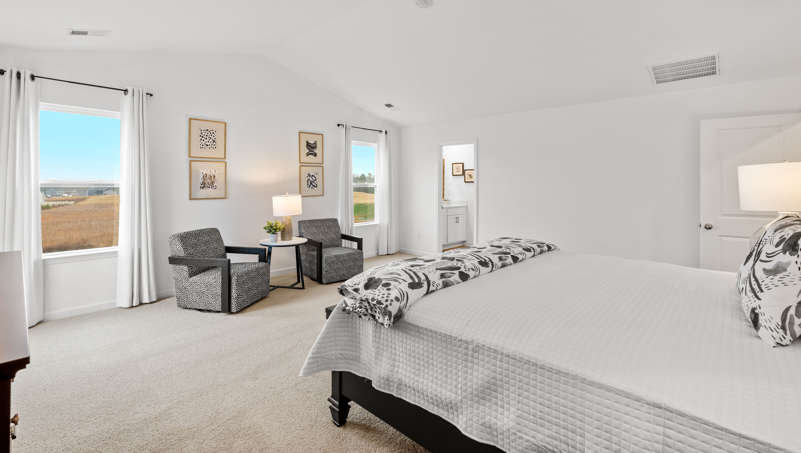 Bedroom with carpet and window.