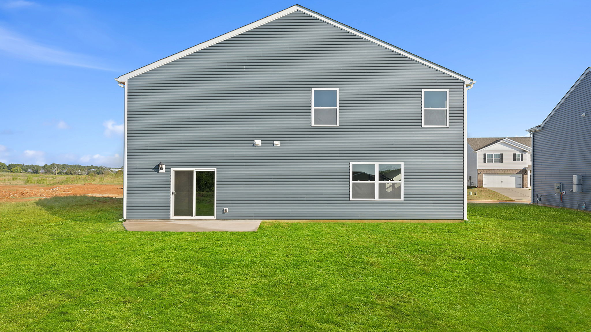 Back exterior with large backyard.