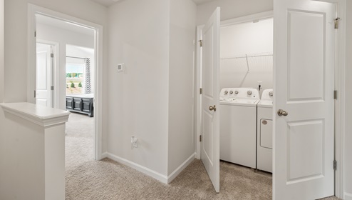 Loft area with carpet.