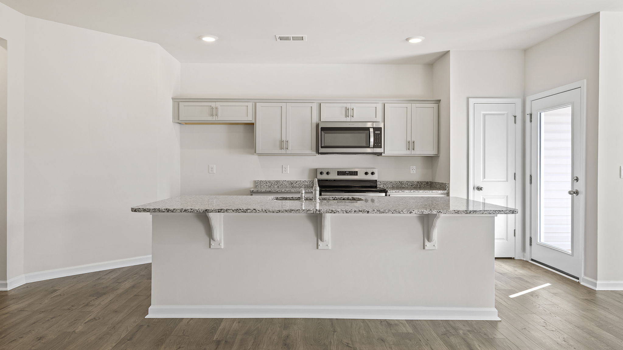 Kitchen island with granite countertops.