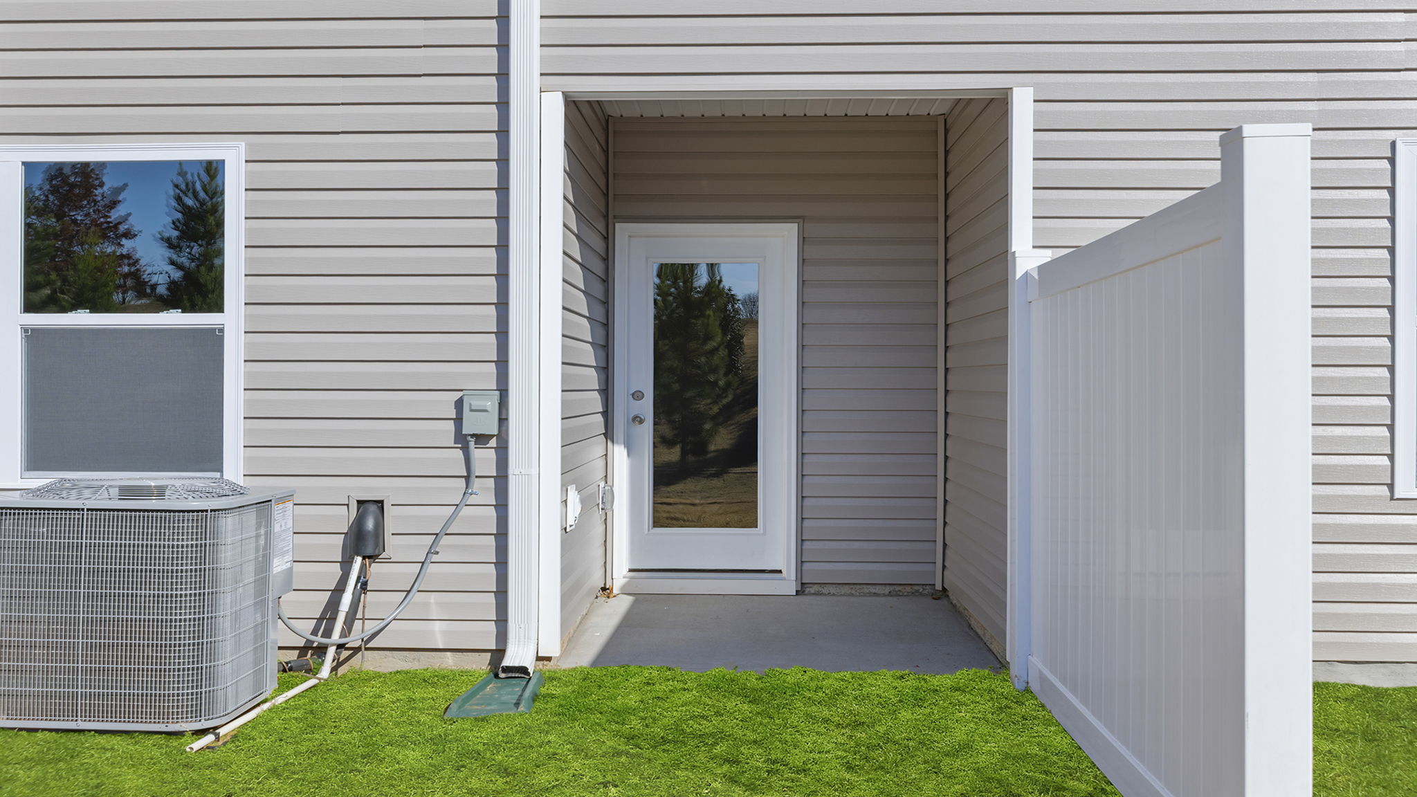 Back exterior view of home and patio.