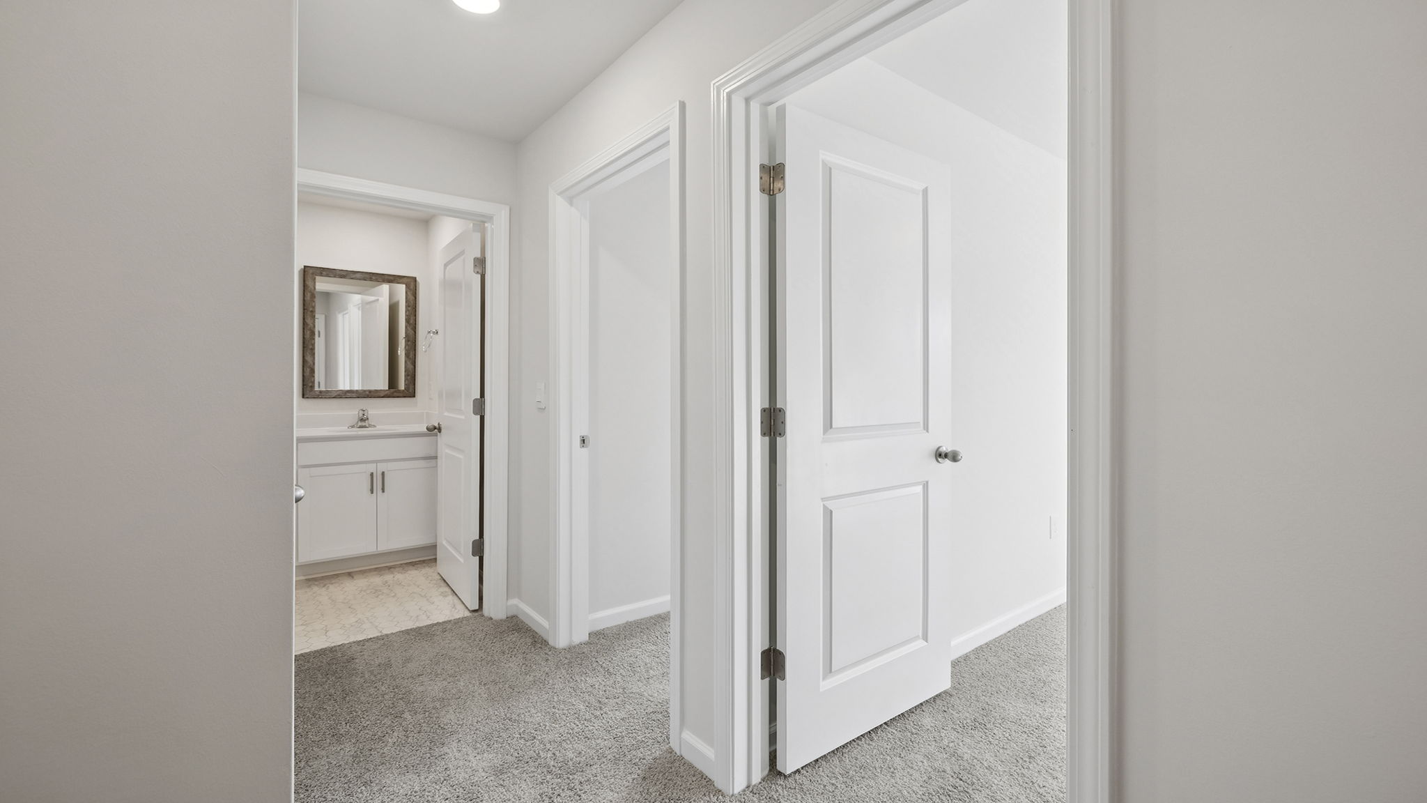 Hallway view of bedrooms and hall bathroom.
