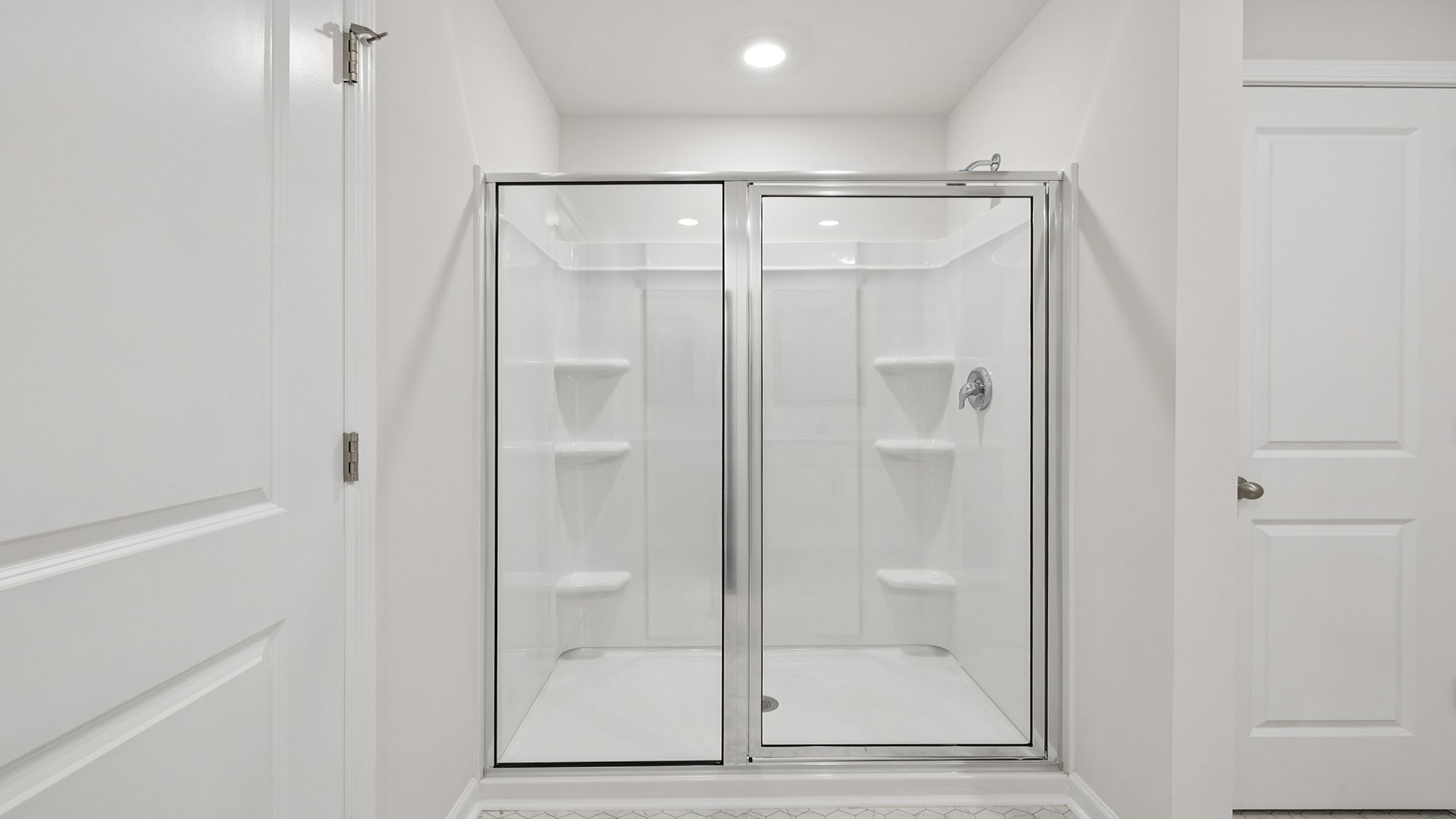 Primary bathroom with walk-in shower.