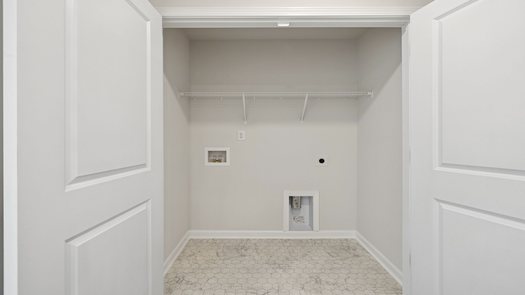 Laundry room with shelving.