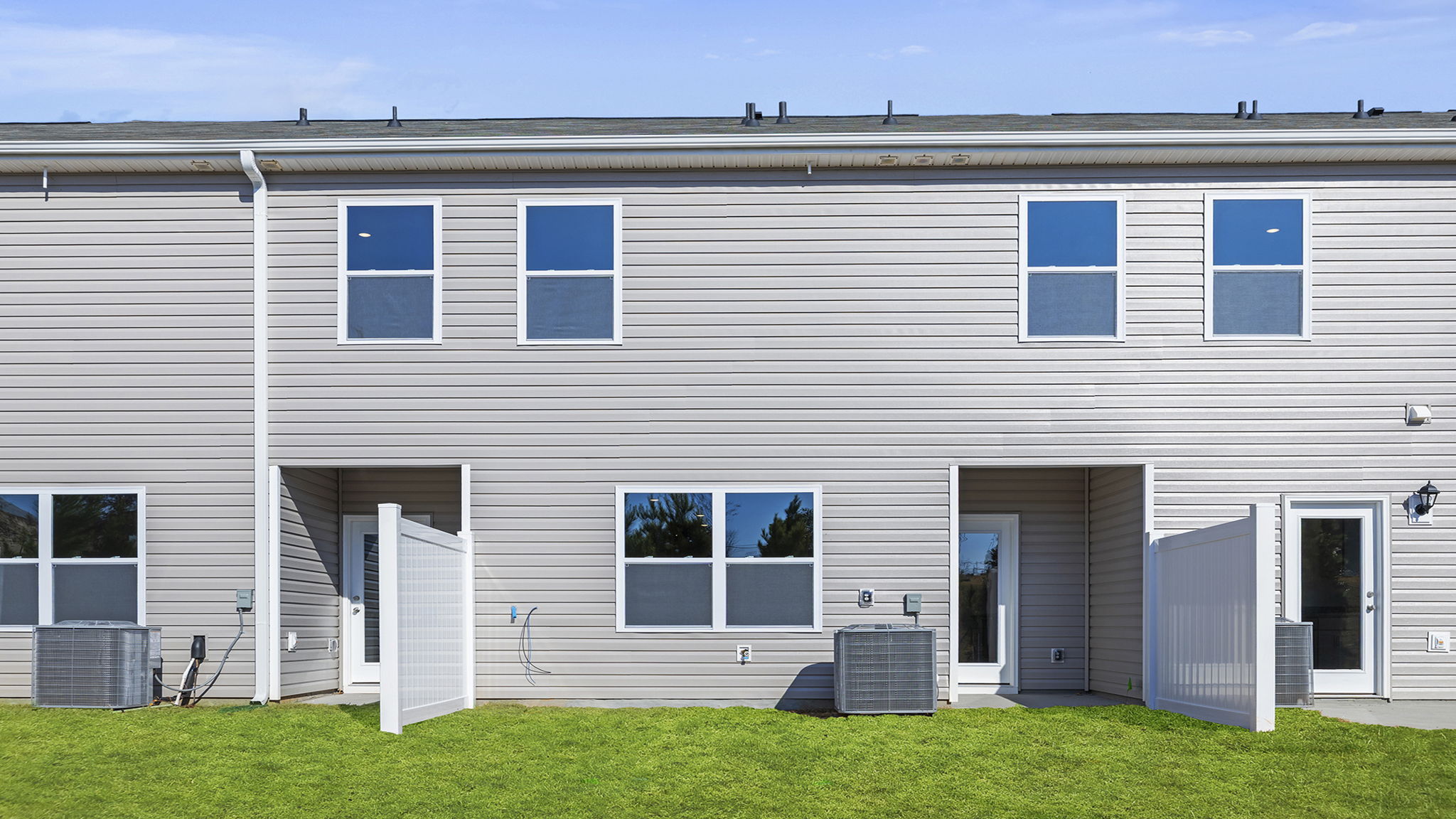 Back exterior view of home and patio.