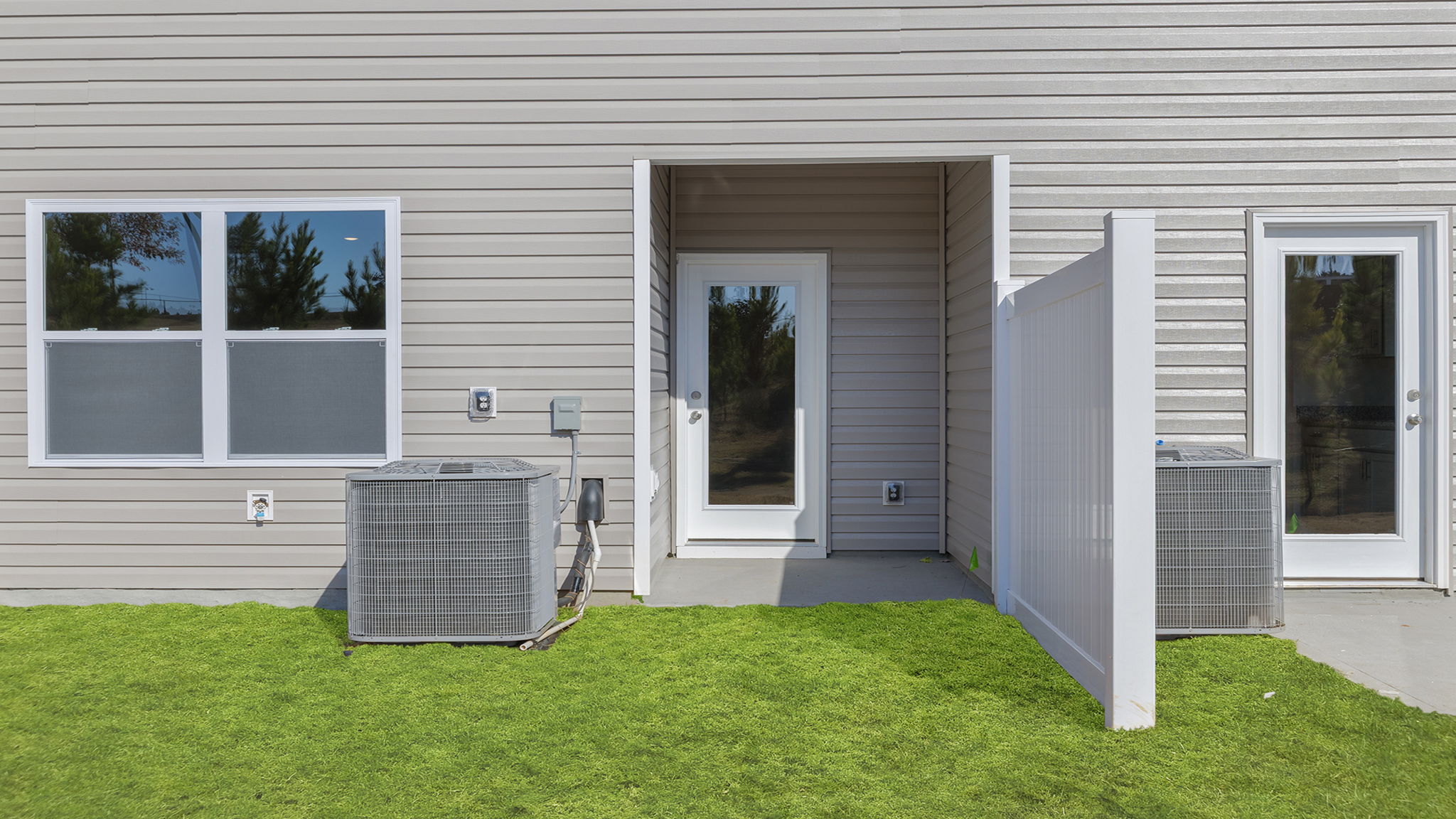 Back exterior view of home and patio.