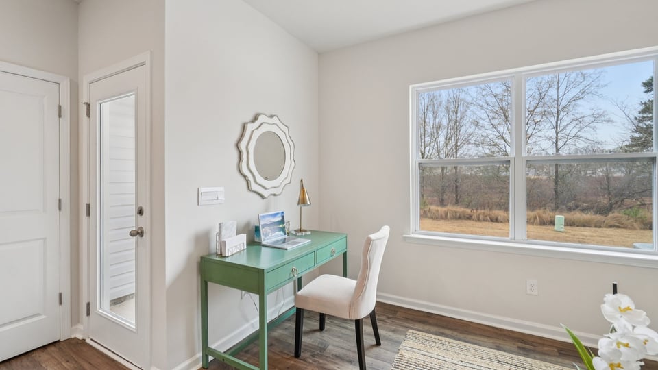 Family room with windows and fireplace.