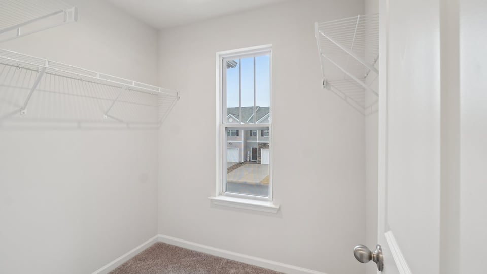 Closet with hanging storage racks.