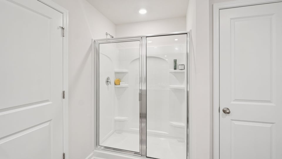 Bathroom with walk in shower.