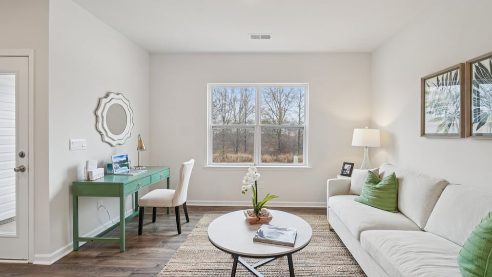 Family room with windows and fireplace.