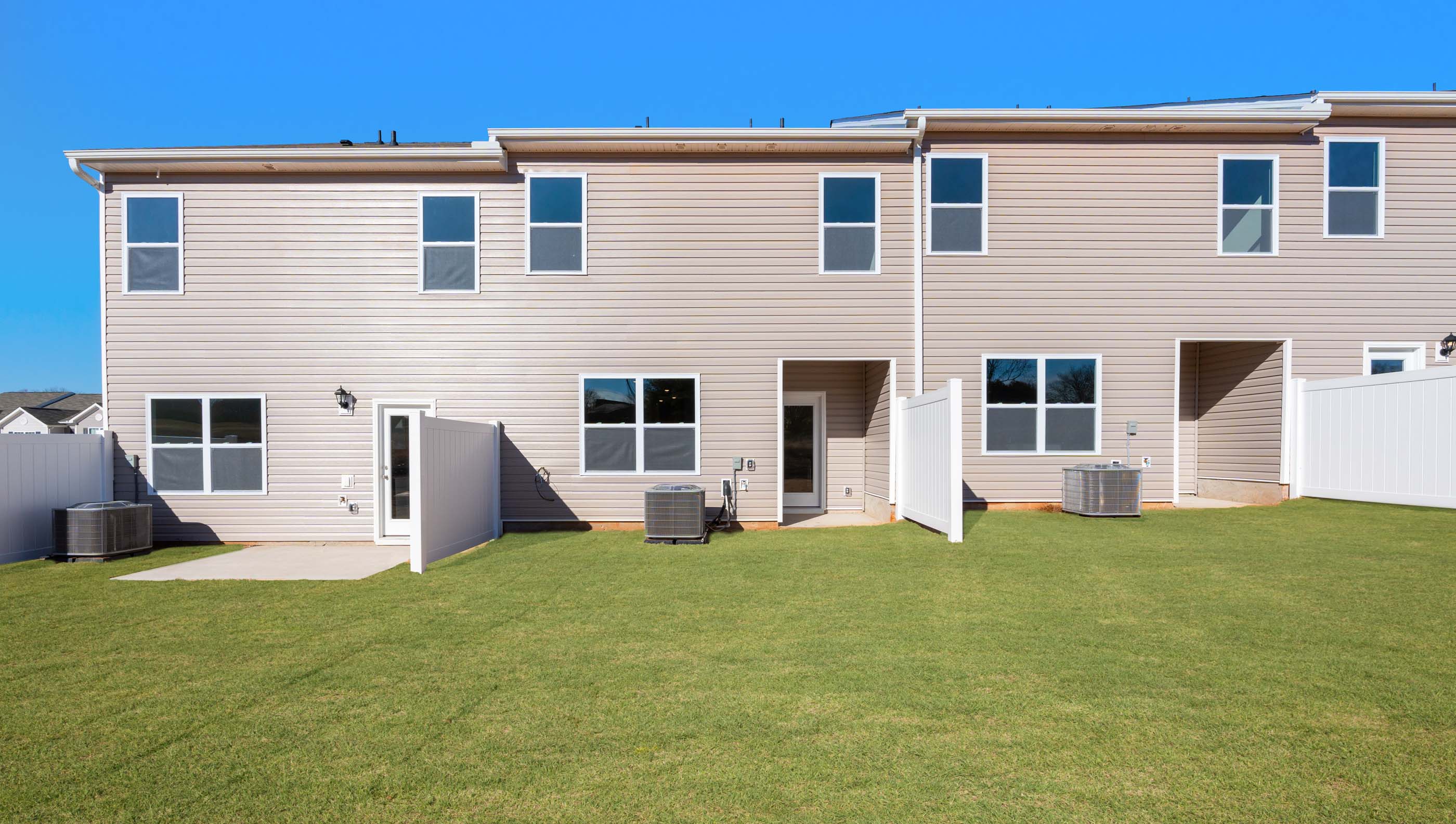 Back exterior view of home and patio.