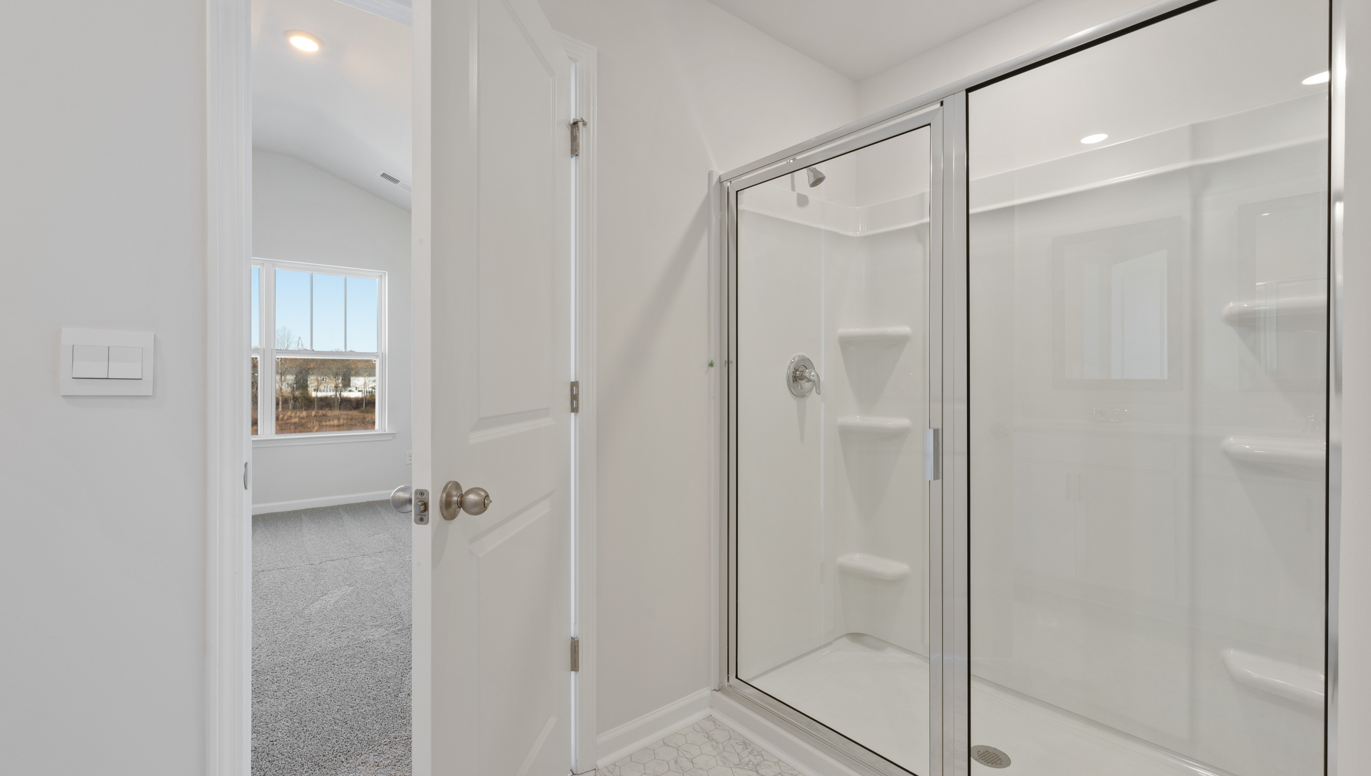 Primary bathroom with walk-in shower.