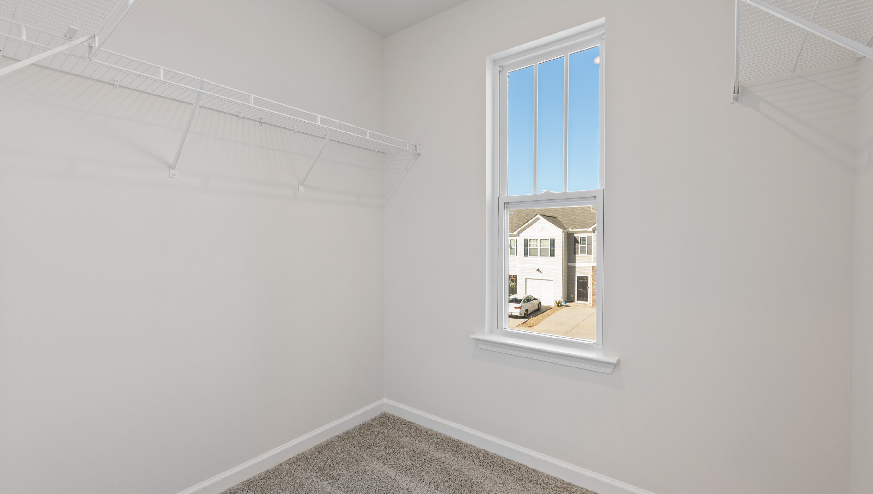 Primary bedroom walk-in closet.