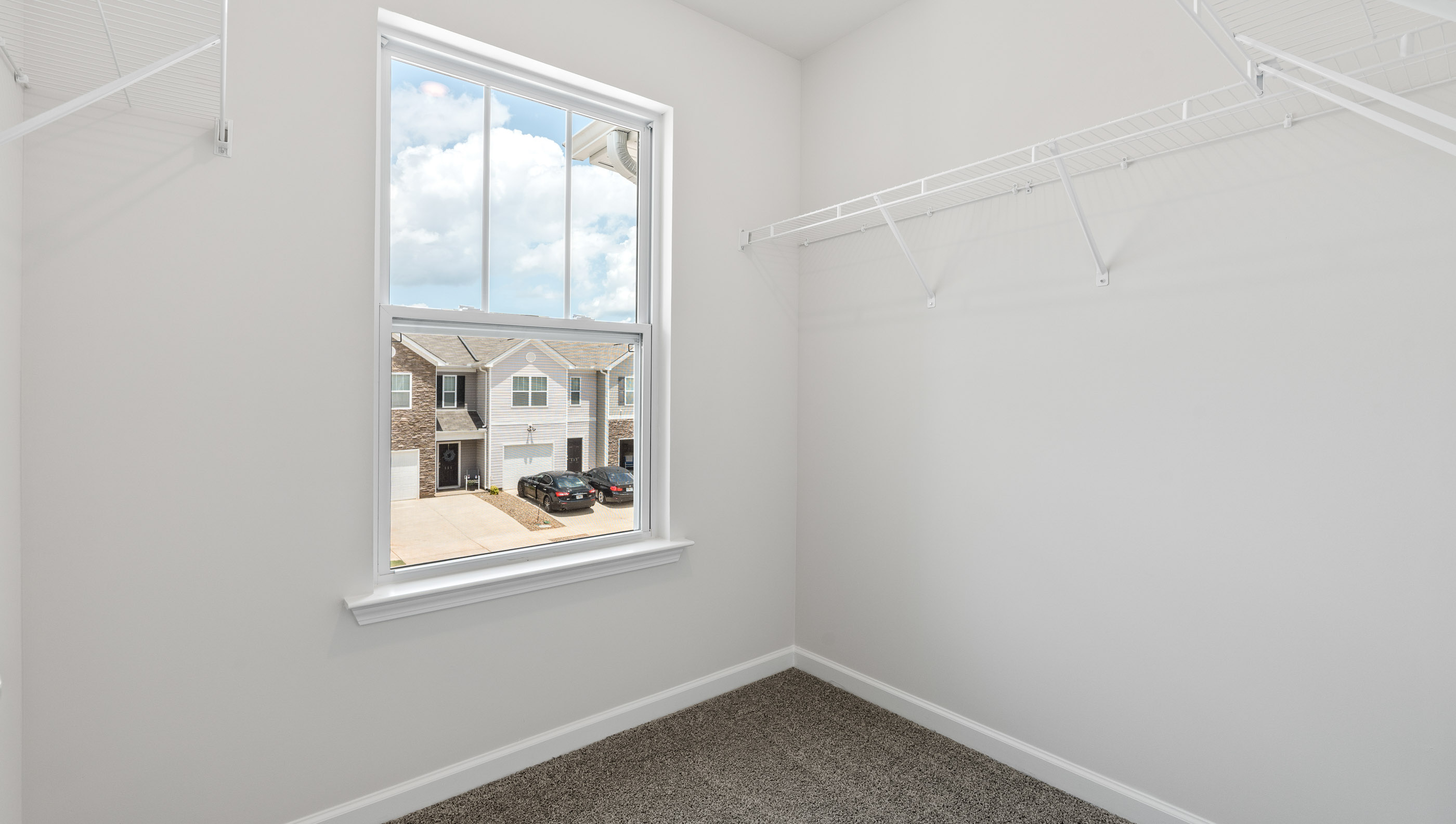 Primary bedroom walk-in closet.