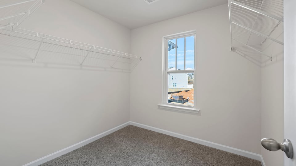 Primary bedroom walk-in closet.